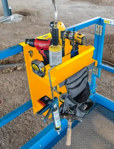 scissor lift tray in use on lift railing